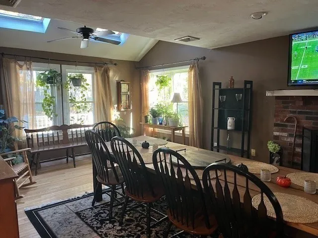a view of a dining room with furniture window and outside view