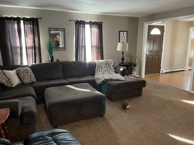 a living room with furniture and a window