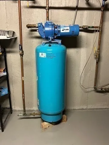 a view of a room with water heater and a air conditioner