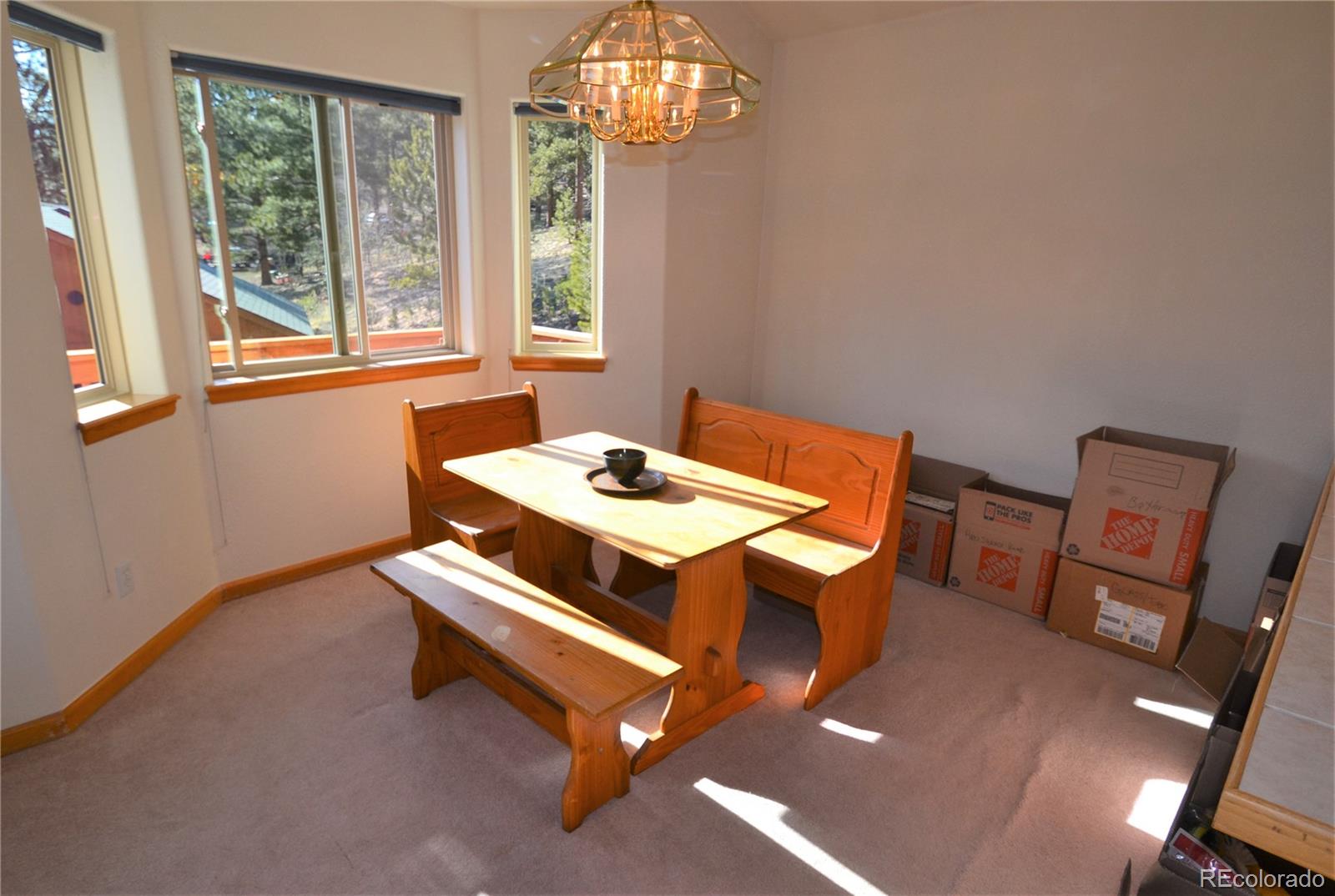 627 North Random Road Bailey, CO 80421 - Photo 6 of 15 a room with chairs and window