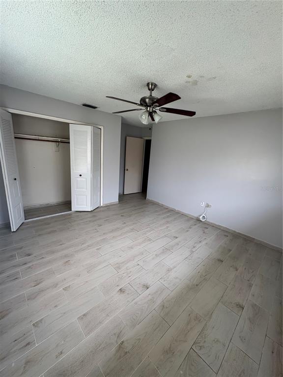 4027 Bianca Street Sebring, FL 33872 - Photo 2 of 22 a view of a livingroom with a ceiling fan and window