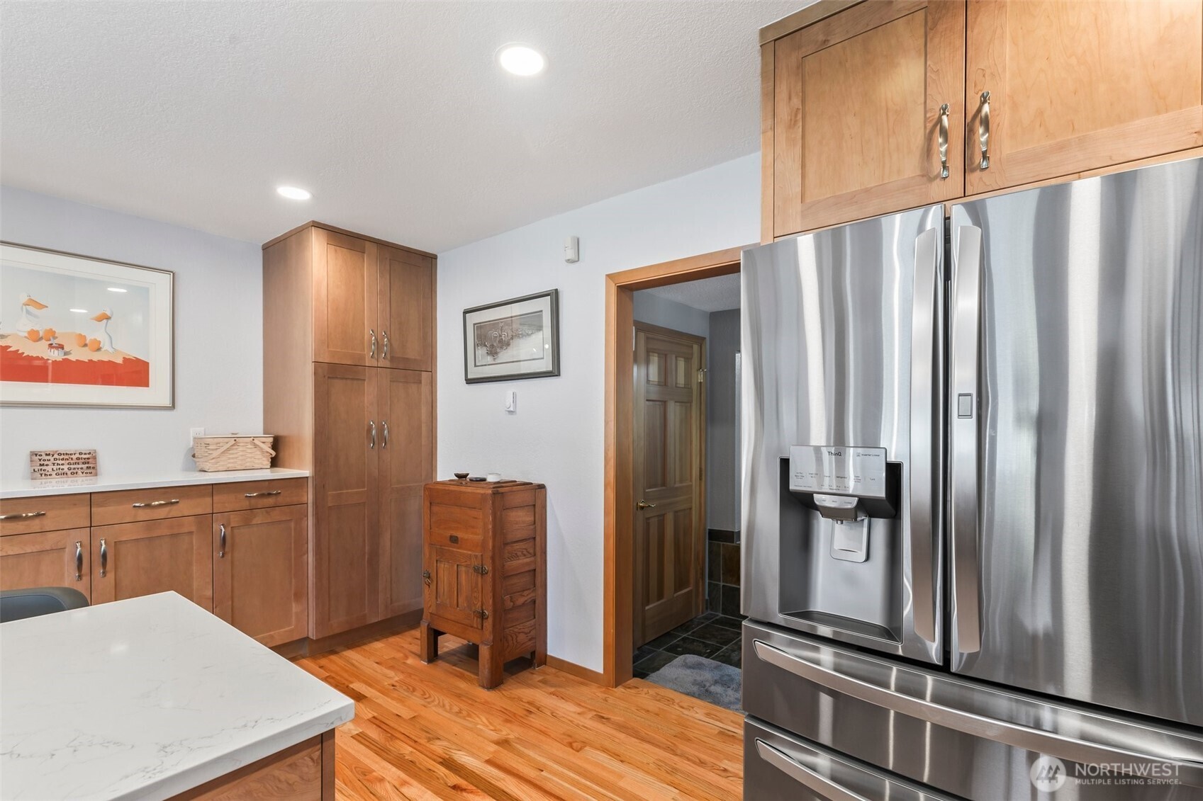 1207 Creso Road South Spanaway, WA 98387 - Photo 14 of 40 a kitchen with stainless steel appliances a refrigerator and cabinets