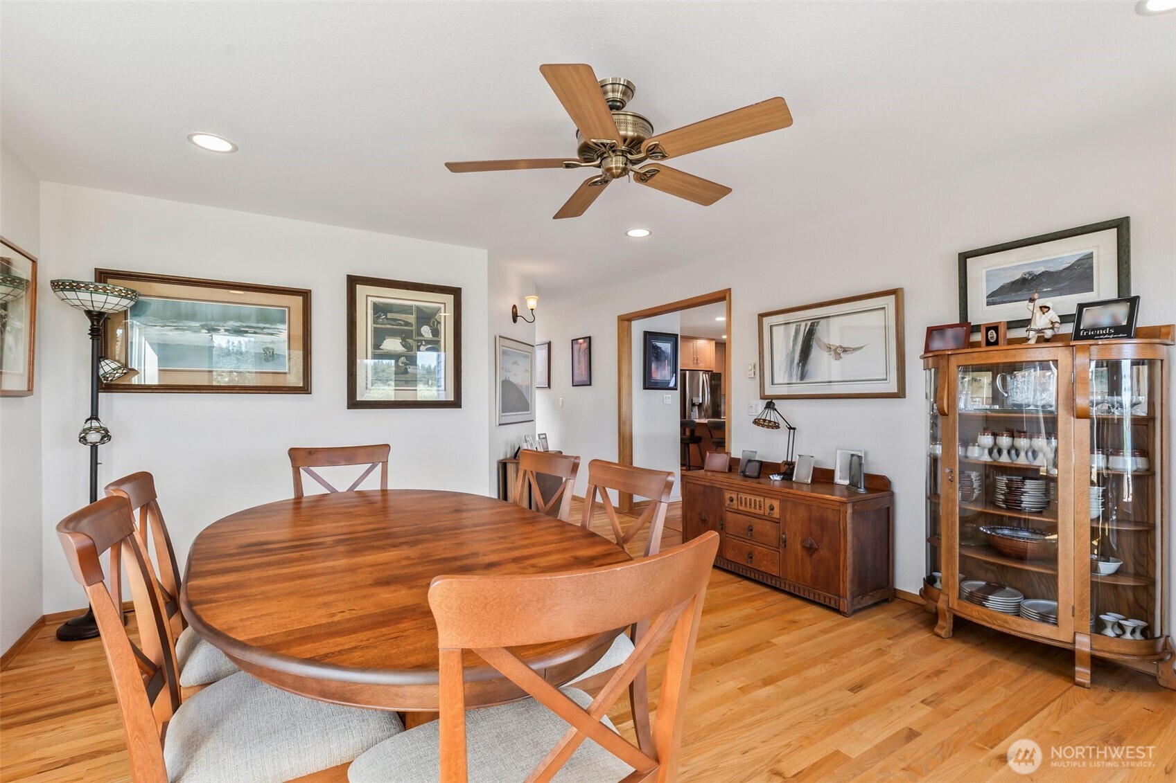 1207 Creso Road South Spanaway, WA 98387 - Photo 18 of 40 a dining room with wooden floor and furniture