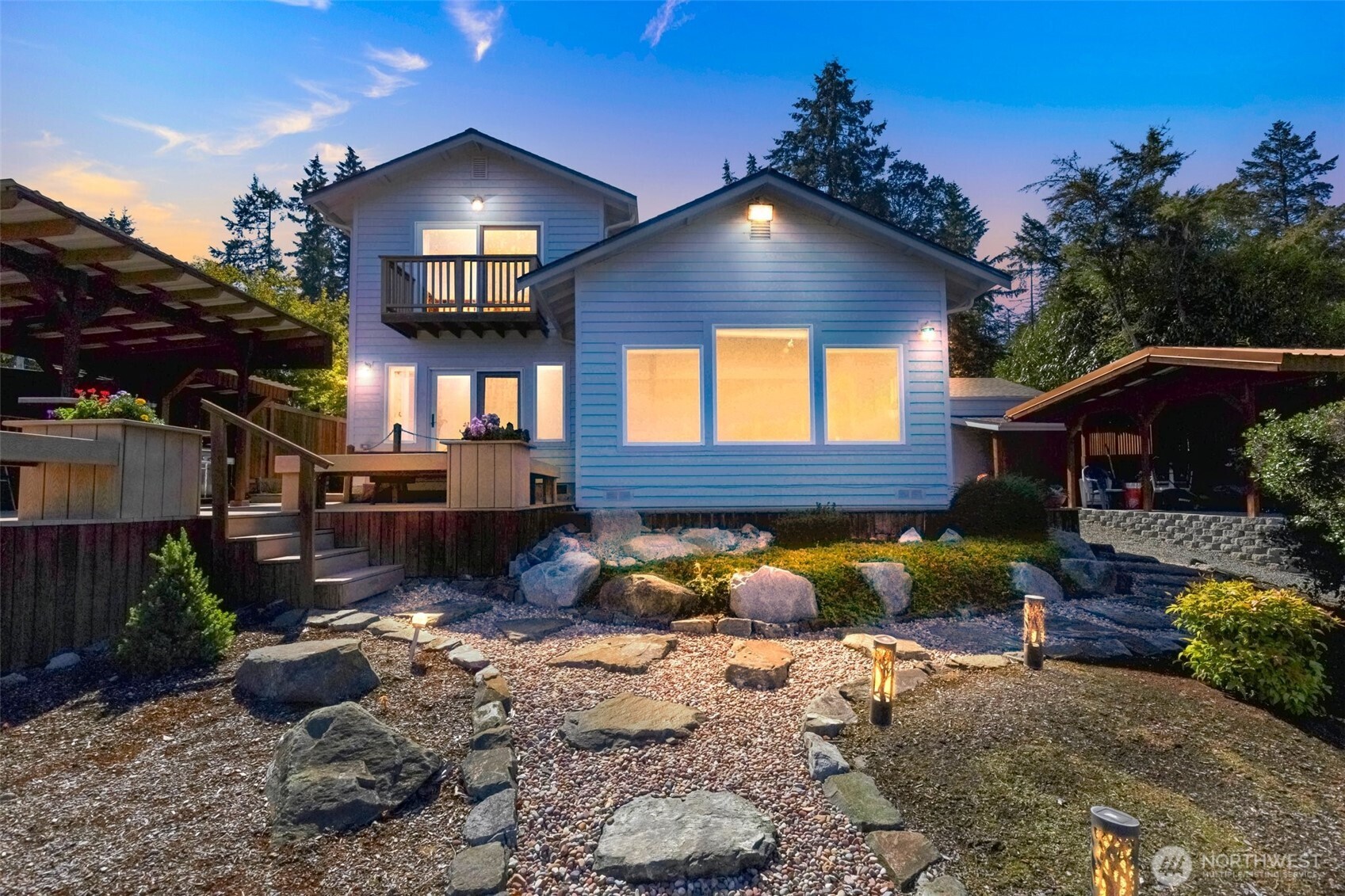 1207 Creso Road South Spanaway, WA 98387 - Photo 2 of 40 a yellow and red umbrella in a backyard of house