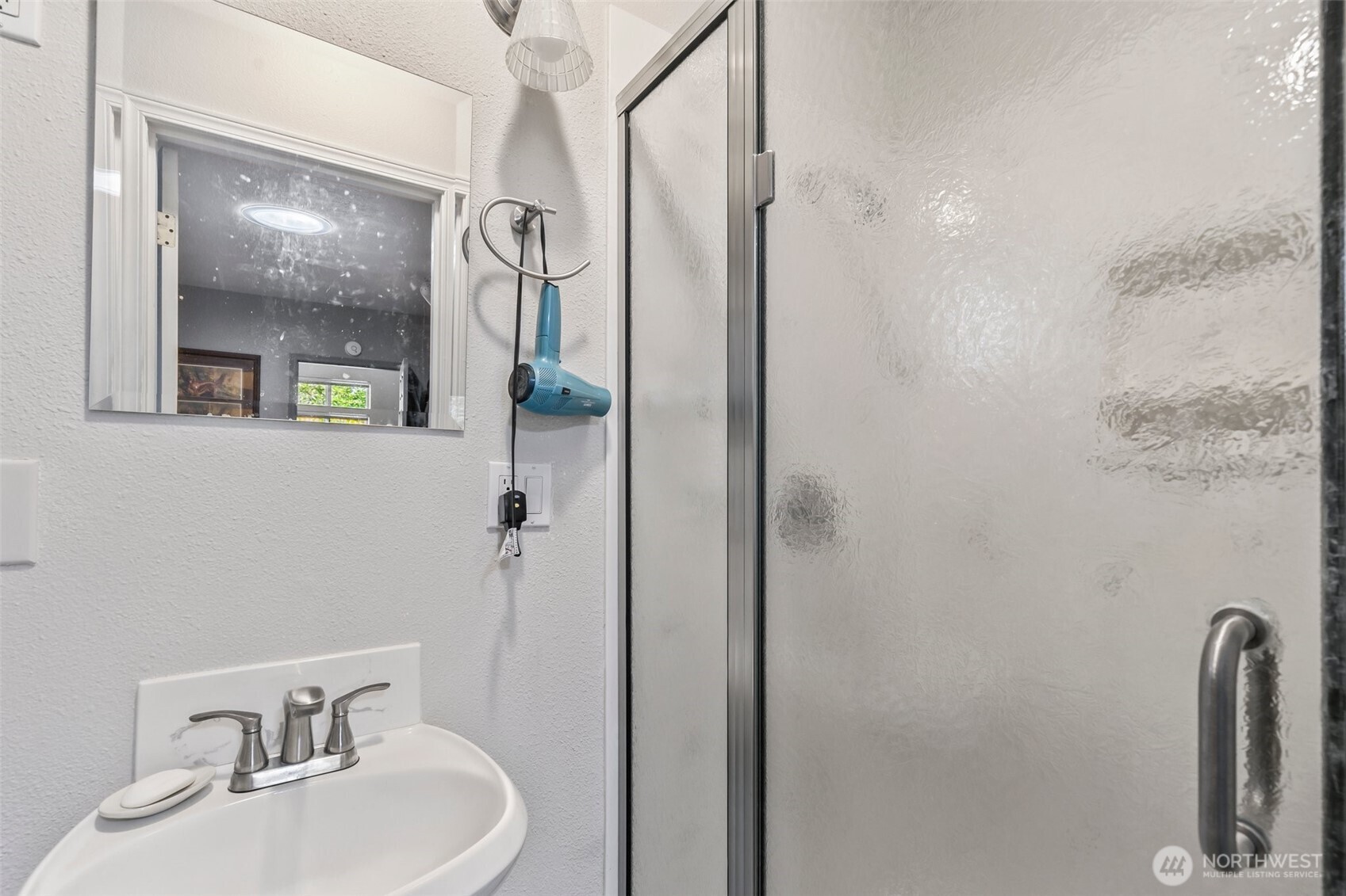 1207 Creso Road South Spanaway, WA 98387 - Photo 25 of 40 a bathroom with a sink and mirror