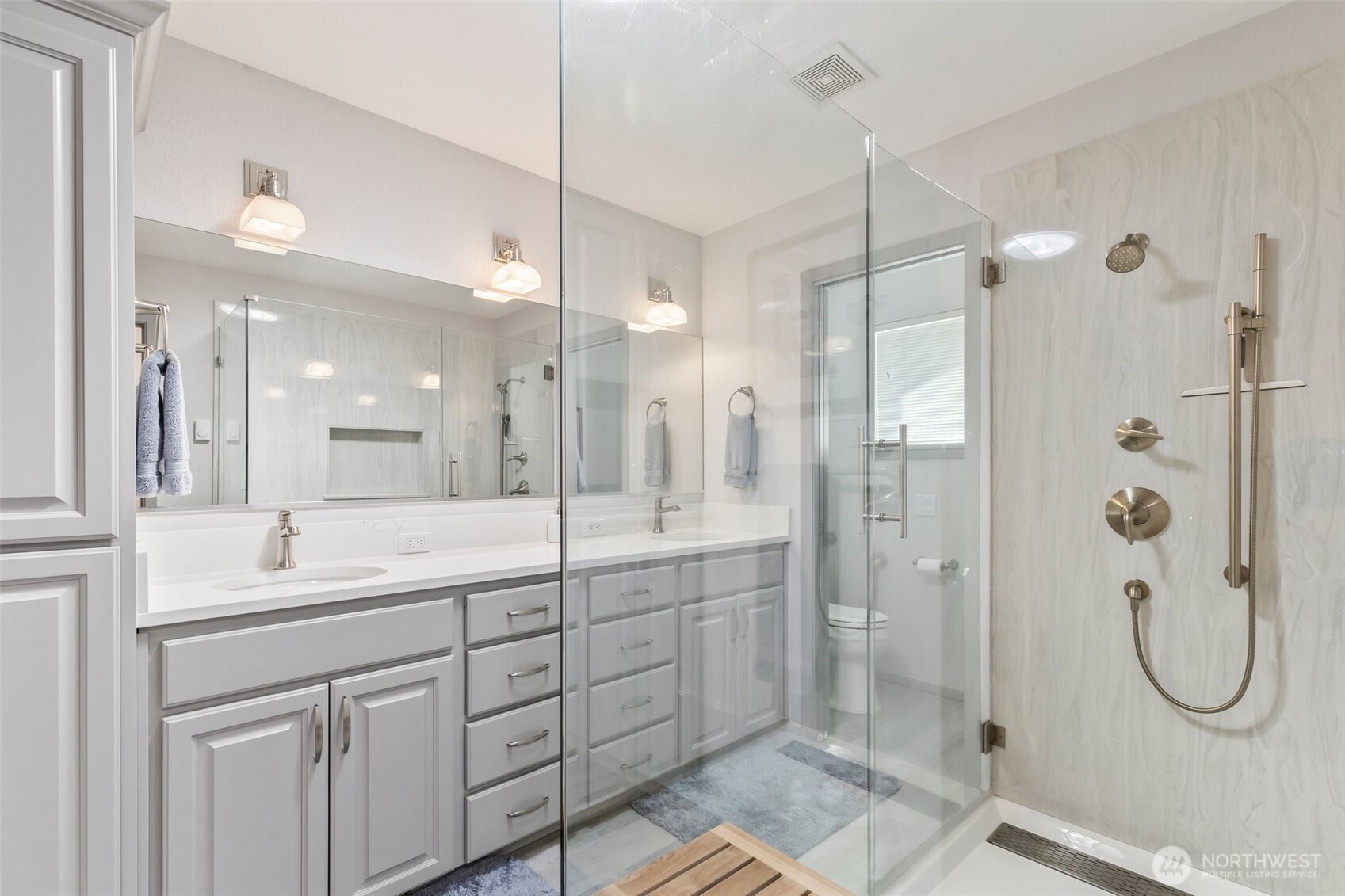1207 Creso Road South Spanaway, WA 98387 - Photo 27 of 40 a bathroom with a double vanity sink mirror and shower