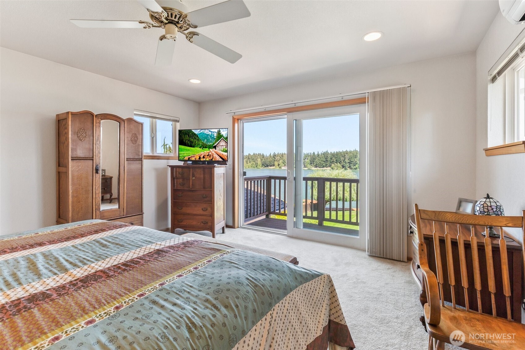 1207 Creso Road South Spanaway, WA 98387 - Photo 31 of 40 a spacious bedroom with a bed and a large window