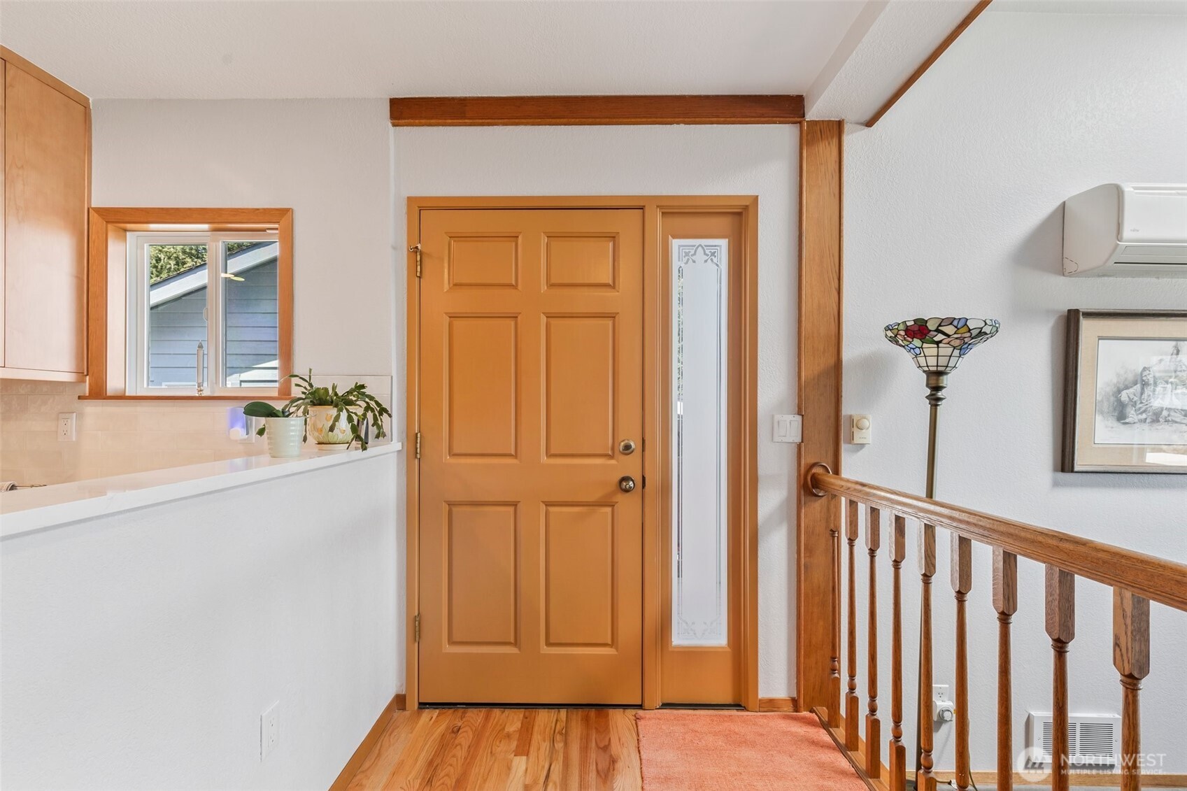1207 Creso Road South Spanaway, WA 98387 - Photo 5 of 40 a view of a hallway with wooden floor and staircase