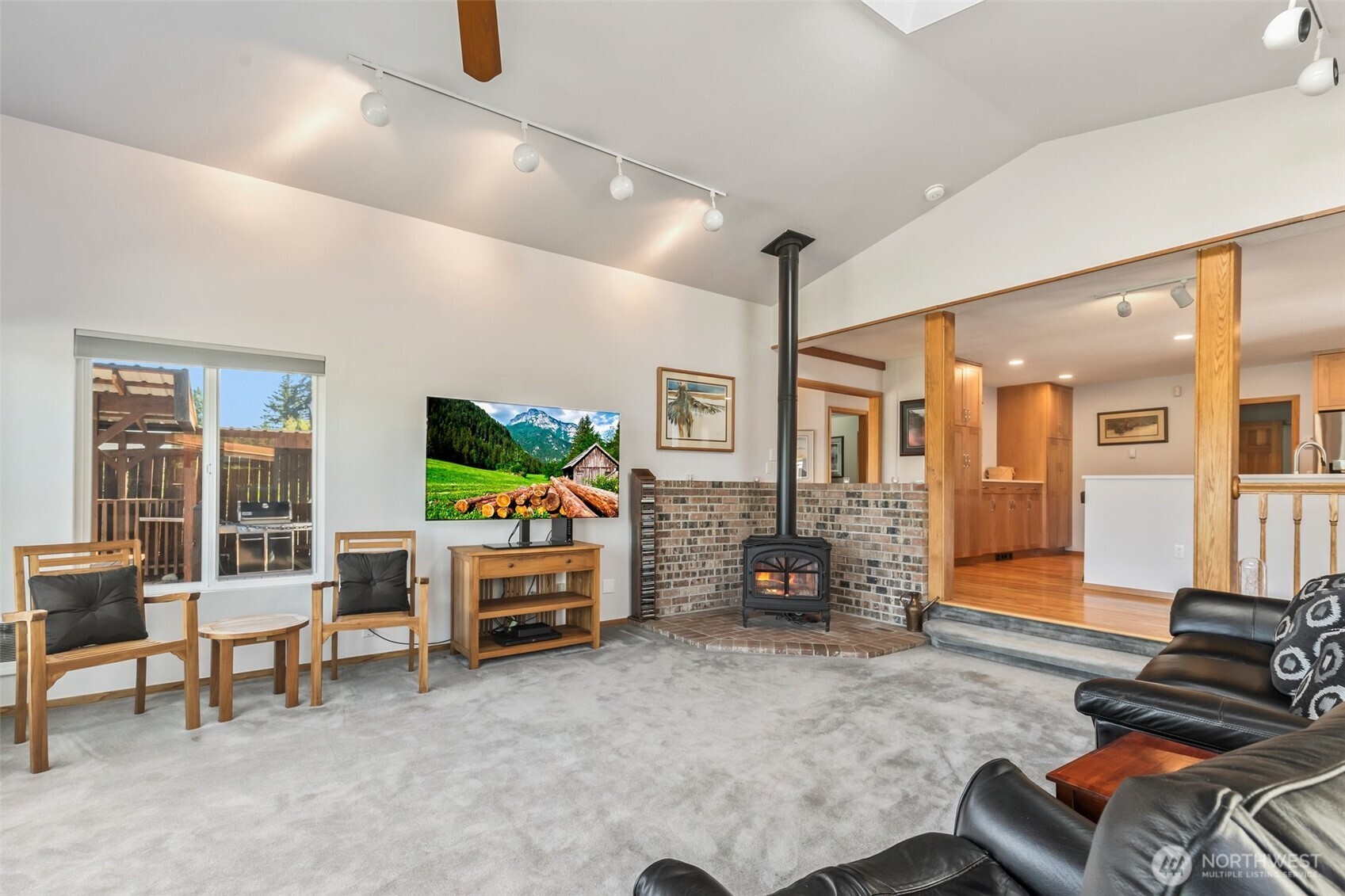 1207 Creso Road South Spanaway, WA 98387 - Photo 8 of 40 a living room with furniture and a flat screen tv