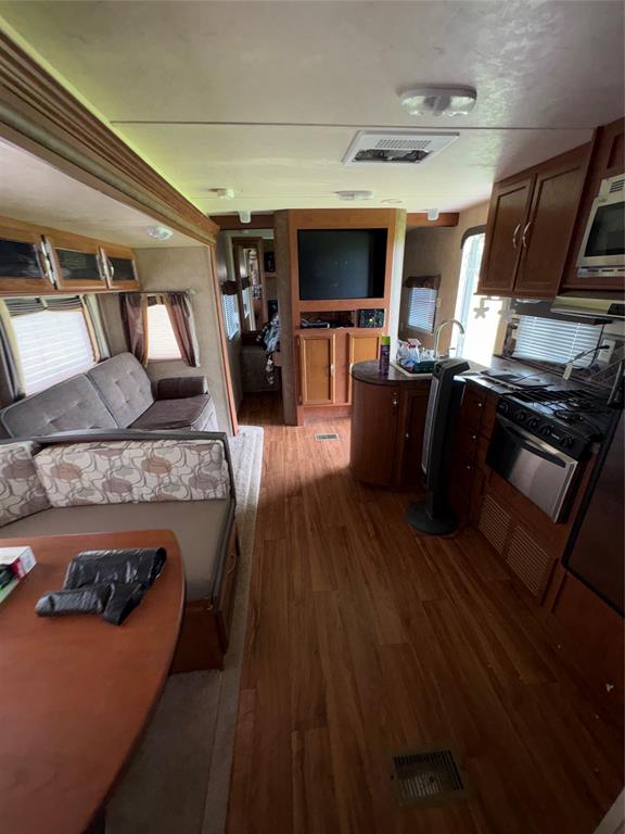 217 Wichita Quitman, TX 75783 - Photo 14 of 17 a living room with furniture and a flat screen tv
