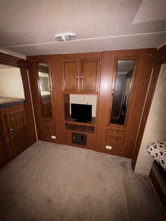 217 Wichita Quitman, TX 75783 - Photo 17 of 17 a living room with furniture and a flat screen tv