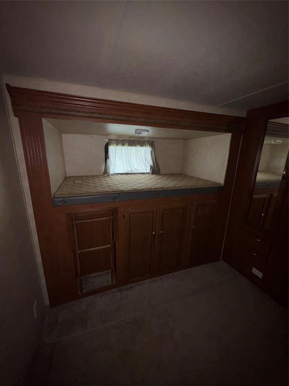 217 Wichita Quitman, TX 75783 - Photo 10 of 17 a living room with a sink and a mirror