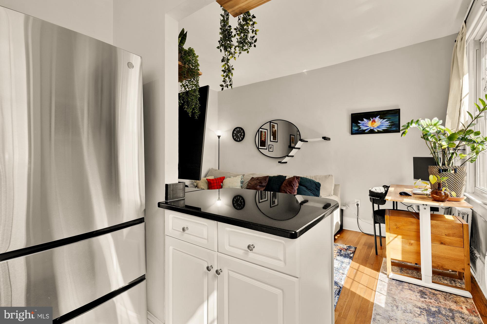 3022 Wisconsin Avenue Northwest, Unit 208 Washington, DC 20016 - Photo 11 of 24 a kitchen with a refrigerator and a stove