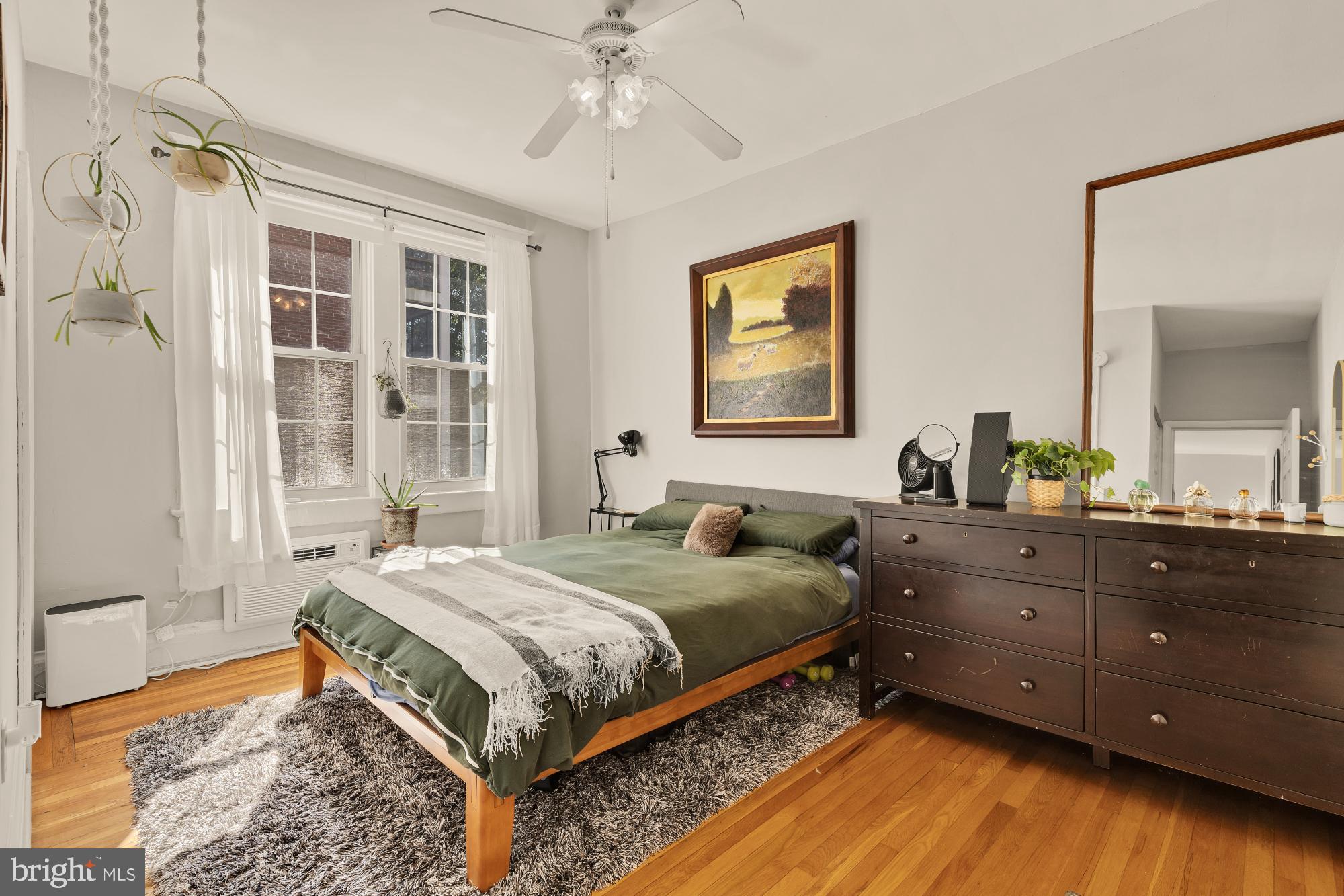 3022 Wisconsin Avenue Northwest, Unit 208 Washington, DC 20016 - Photo 13 of 24 a bedroom with a bed and a window