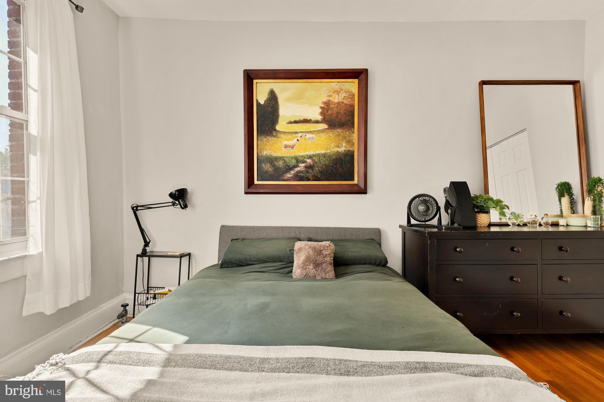 3022 Wisconsin Avenue Northwest, Unit 208 Washington, DC 20016 - Photo 14 of 24 a bedroom with a bed and window