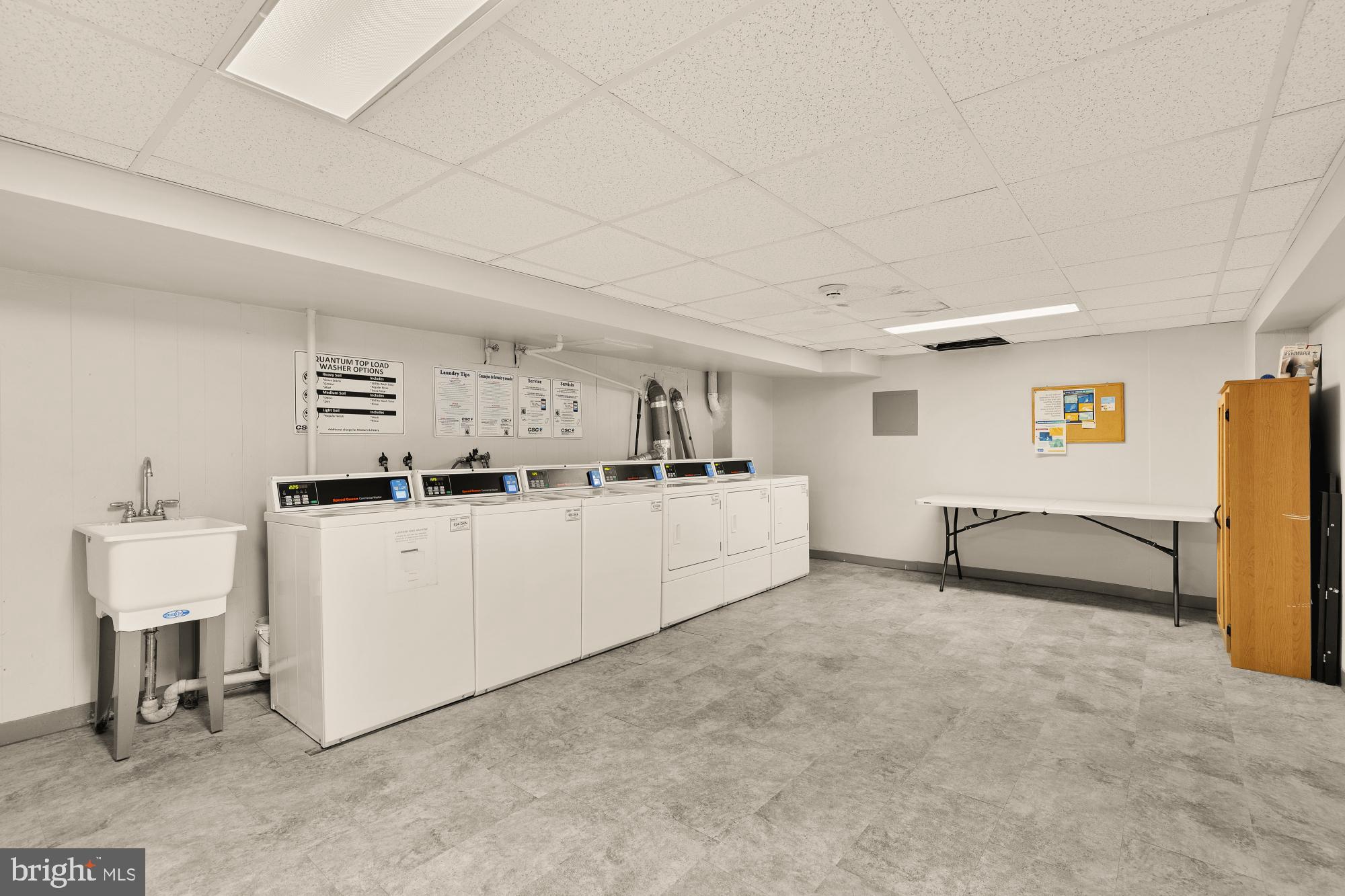 3022 Wisconsin Avenue Northwest, Unit 208 Washington, DC 20016 - Photo 17 of 24 a living room with furniture and a table