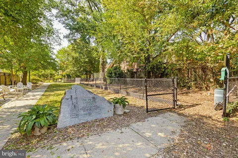 a view of a backyard with sitting area