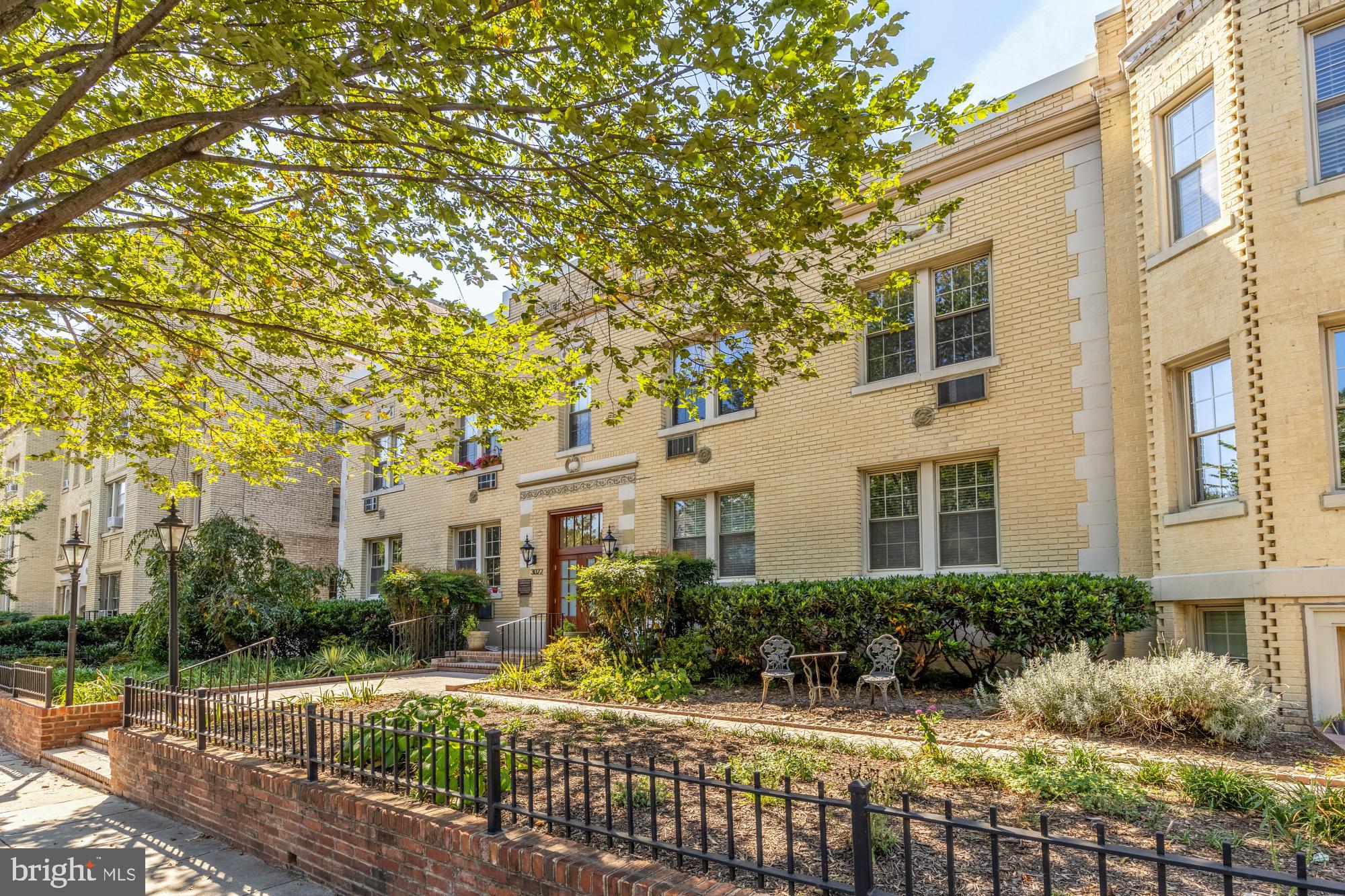 3022 Wisconsin Avenue Northwest, Unit 208 Washington, DC 20016 - Photo 2 of 24 a front view of a house with a yard