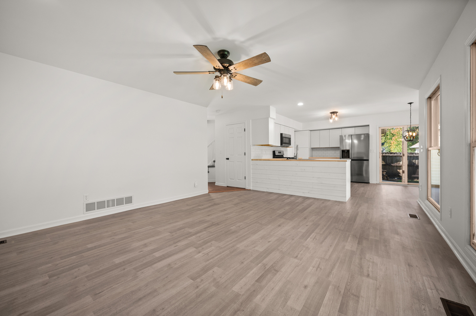 649 Fox Hollow Court DeKalb, IL 60115 - Photo 13 of 38 a view of a kitchen with a sink and a refrigerator