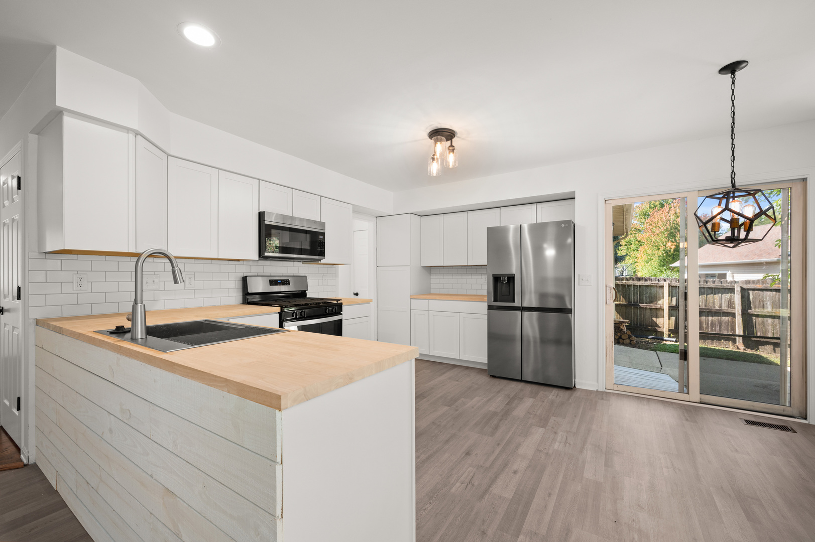 649 Fox Hollow Court DeKalb, IL 60115 - Photo 14 of 38 a kitchen that has a lot of cabinets and stainless steel appliances