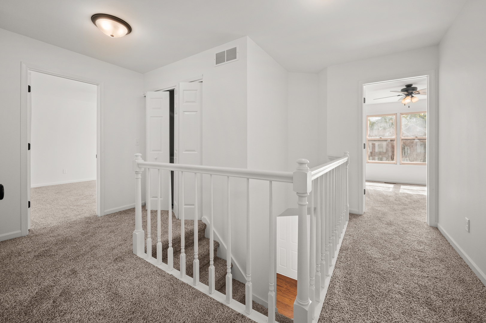649 Fox Hollow Court DeKalb, IL 60115 - Photo 19 of 38 a view of hallway with wooden floor and stairs