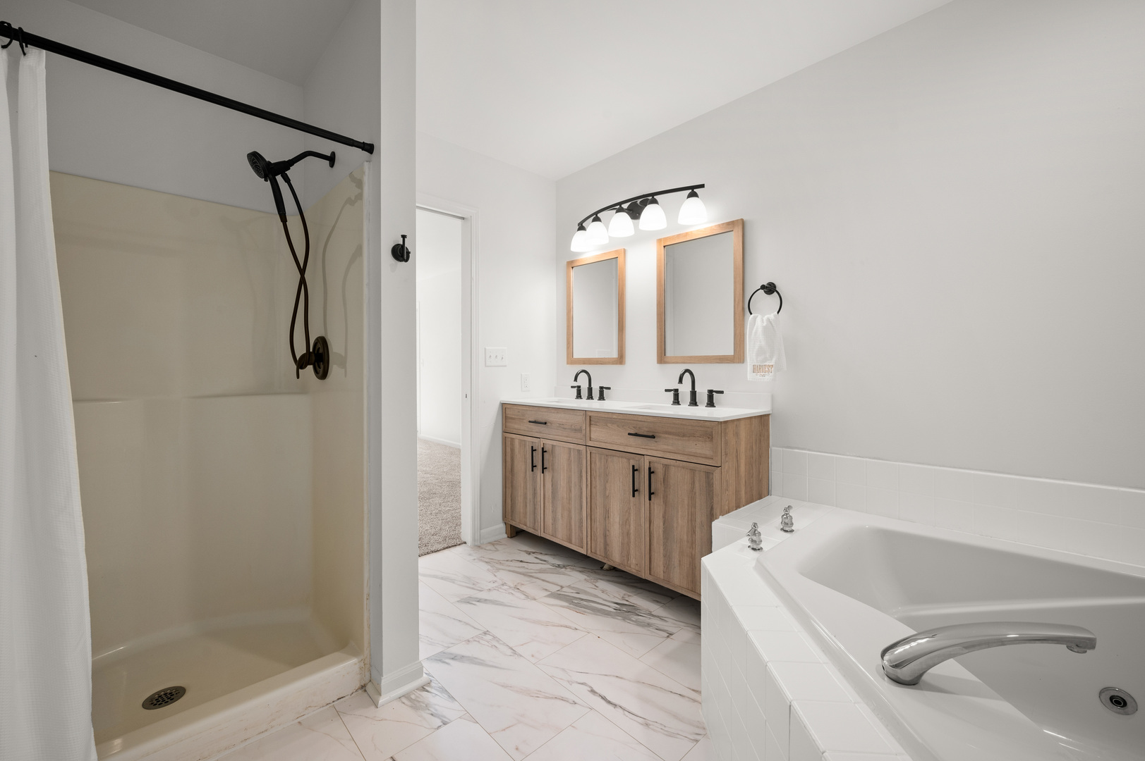 649 Fox Hollow Court DeKalb, IL 60115 - Photo 23 of 38 a bathroom with a tub sink shower and mirror