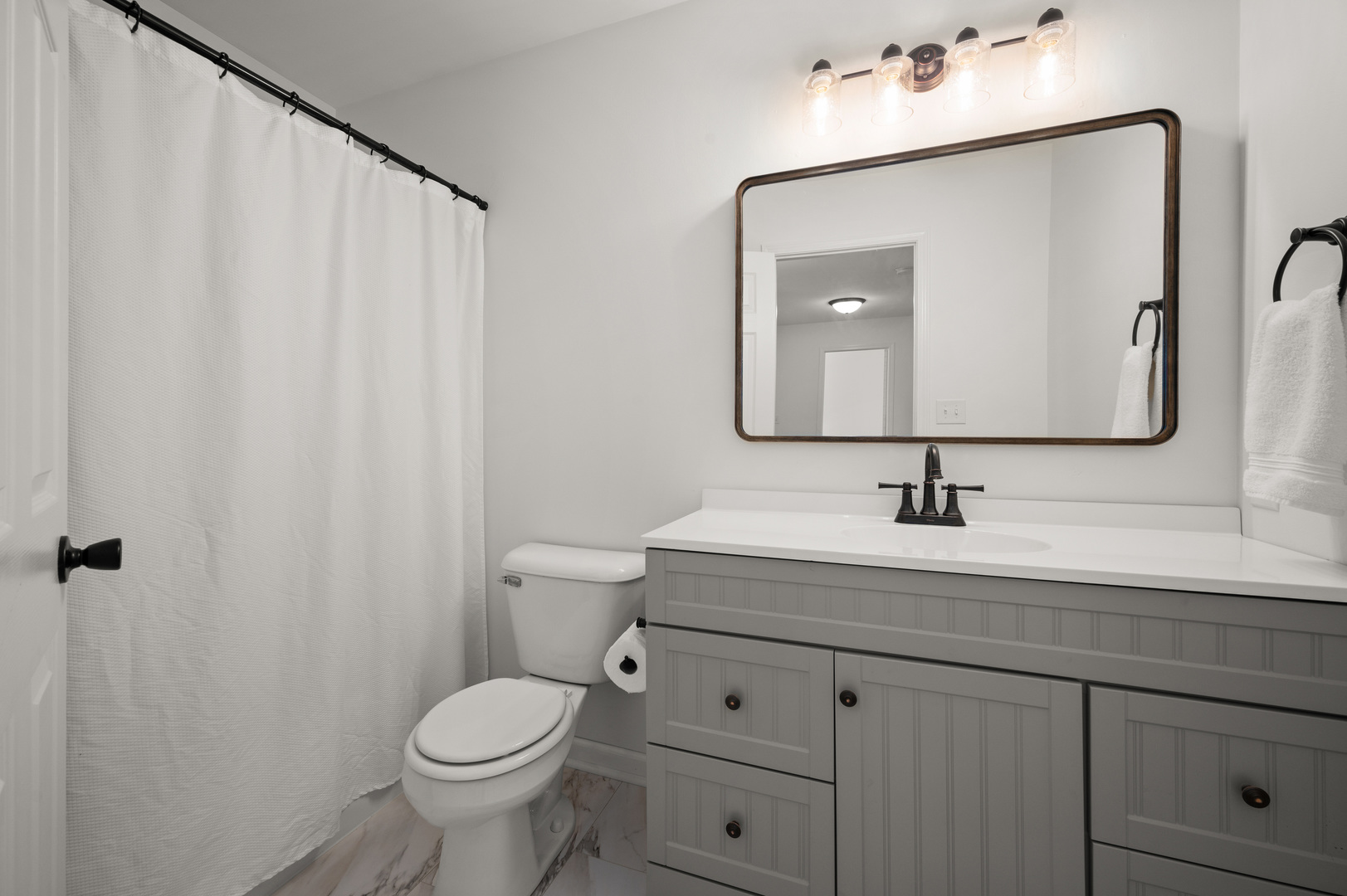 649 Fox Hollow Court DeKalb, IL 60115 - Photo 28 of 38 a bathroom with a toilet sink and mirror