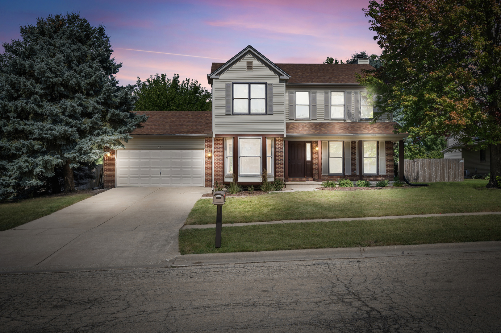 649 Fox Hollow Court DeKalb, IL 60115 - Photo 38 of 38 a front view of a house with a yard