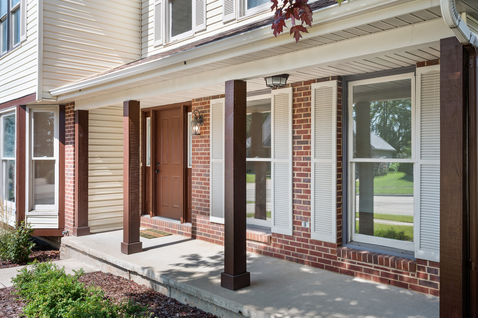 649 Fox Hollow Court DeKalb, IL 60115 - Photo 4 of 38 a front view of a house with a porch