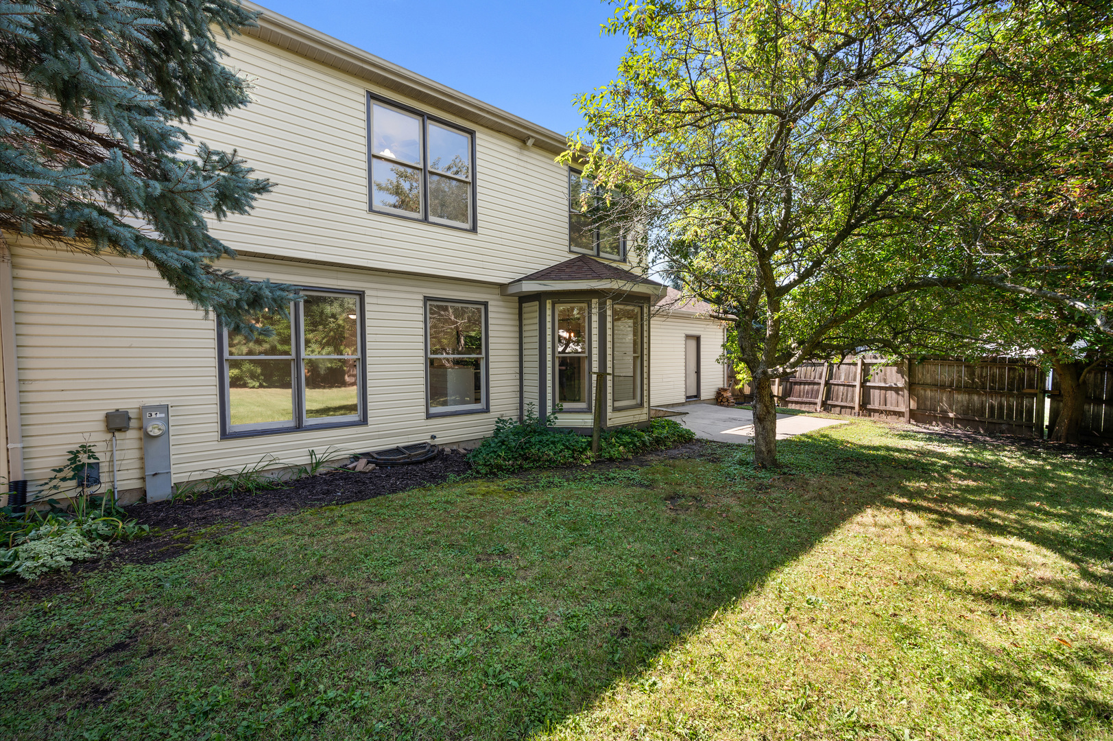 649 Fox Hollow Court DeKalb, IL 60115 - Photo 6 of 38 a view of a yard in front of a house with large tree