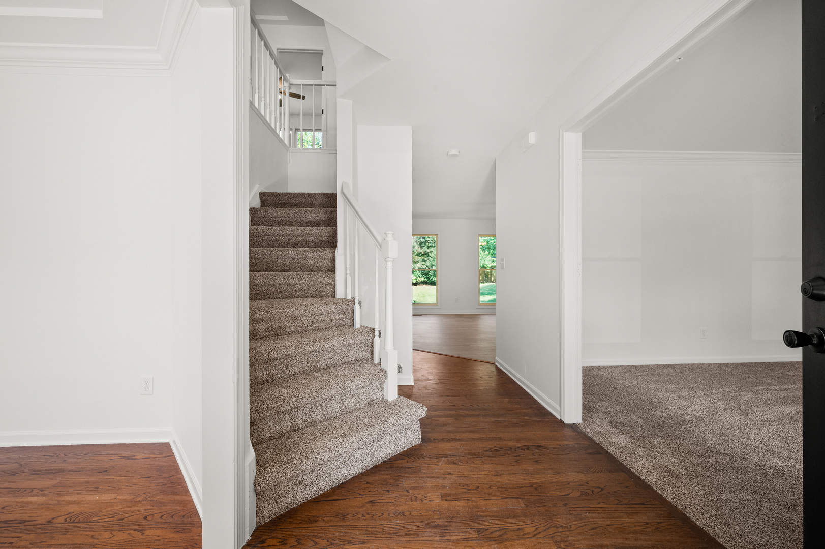 649 Fox Hollow Court DeKalb, IL 60115 - Photo 8 of 38 a view of a hallway with wooden floor and entryway