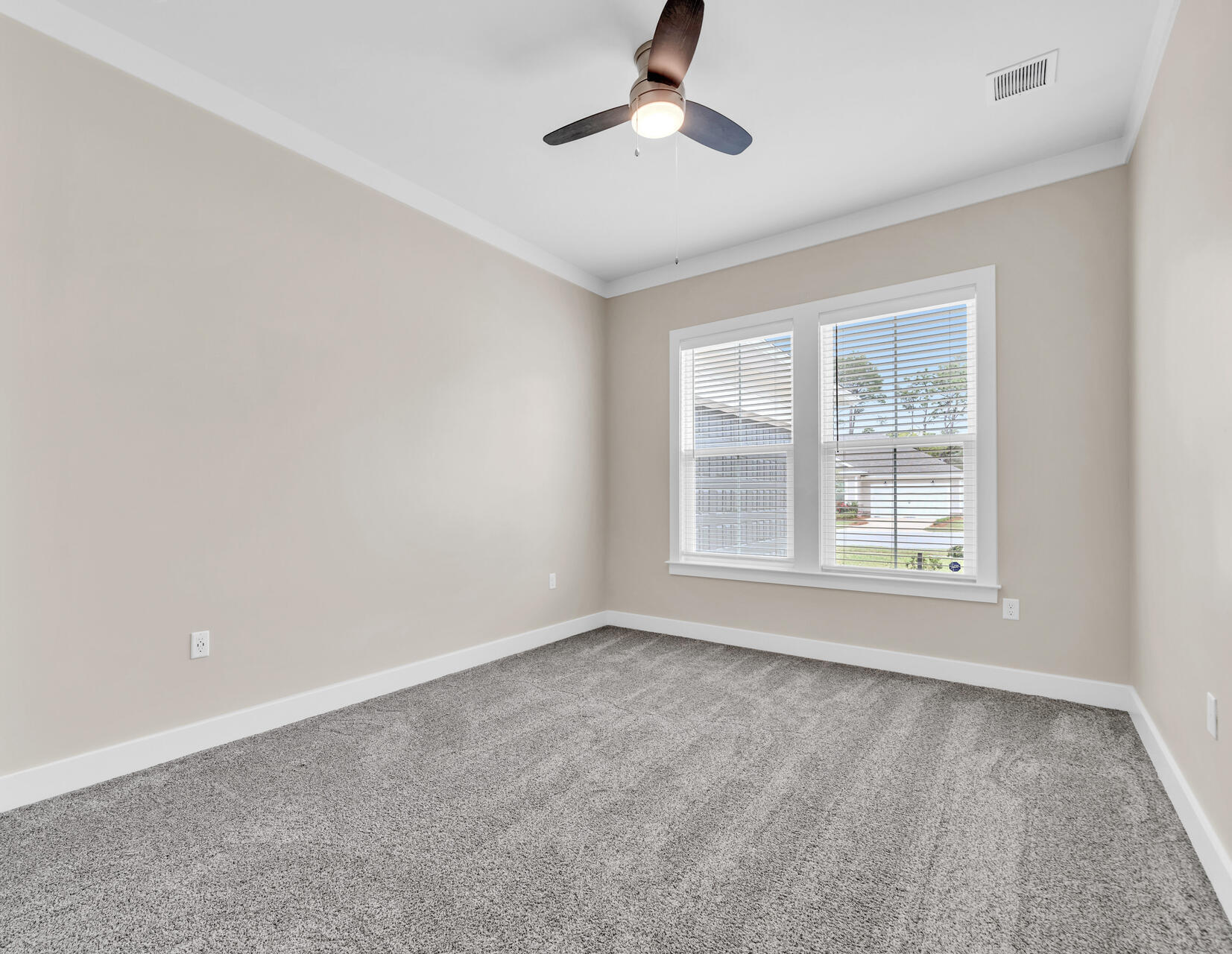 1160 Deer Moss Loop Niceville, FL 32578 - Photo 20 of 60 a view of an empty room with a window