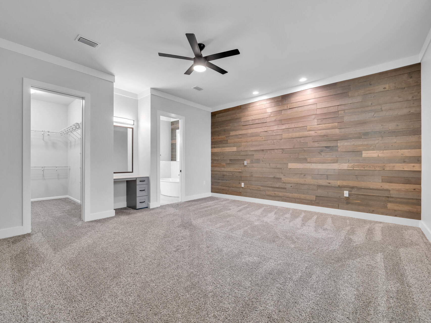 1160 Deer Moss Loop Niceville, FL 32578 - Photo 22 of 60 a view of an empty room with a ceiling fan