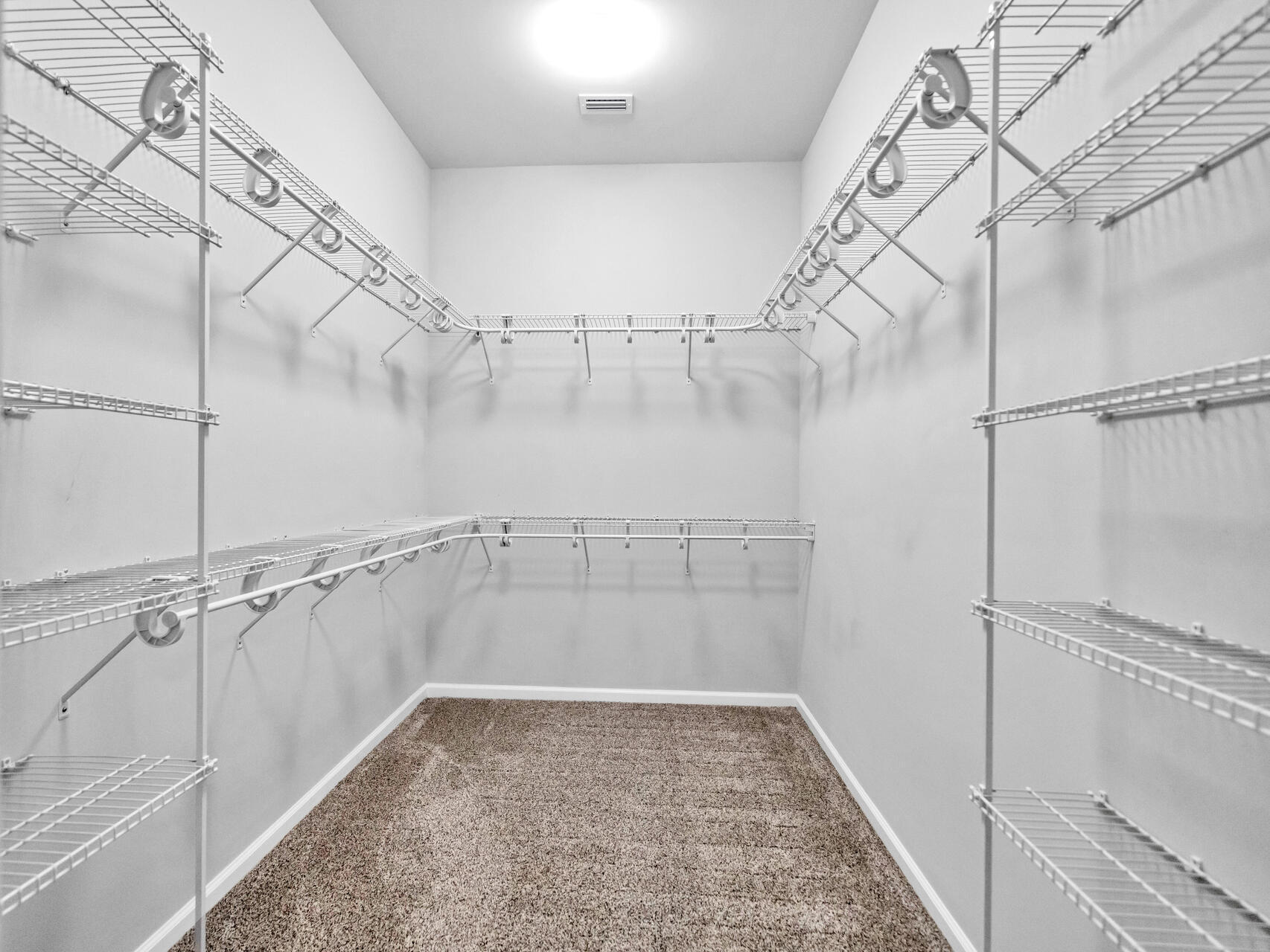 1160 Deer Moss Loop Niceville, FL 32578 - Photo 26 of 60 a view of a room with racks on the wall