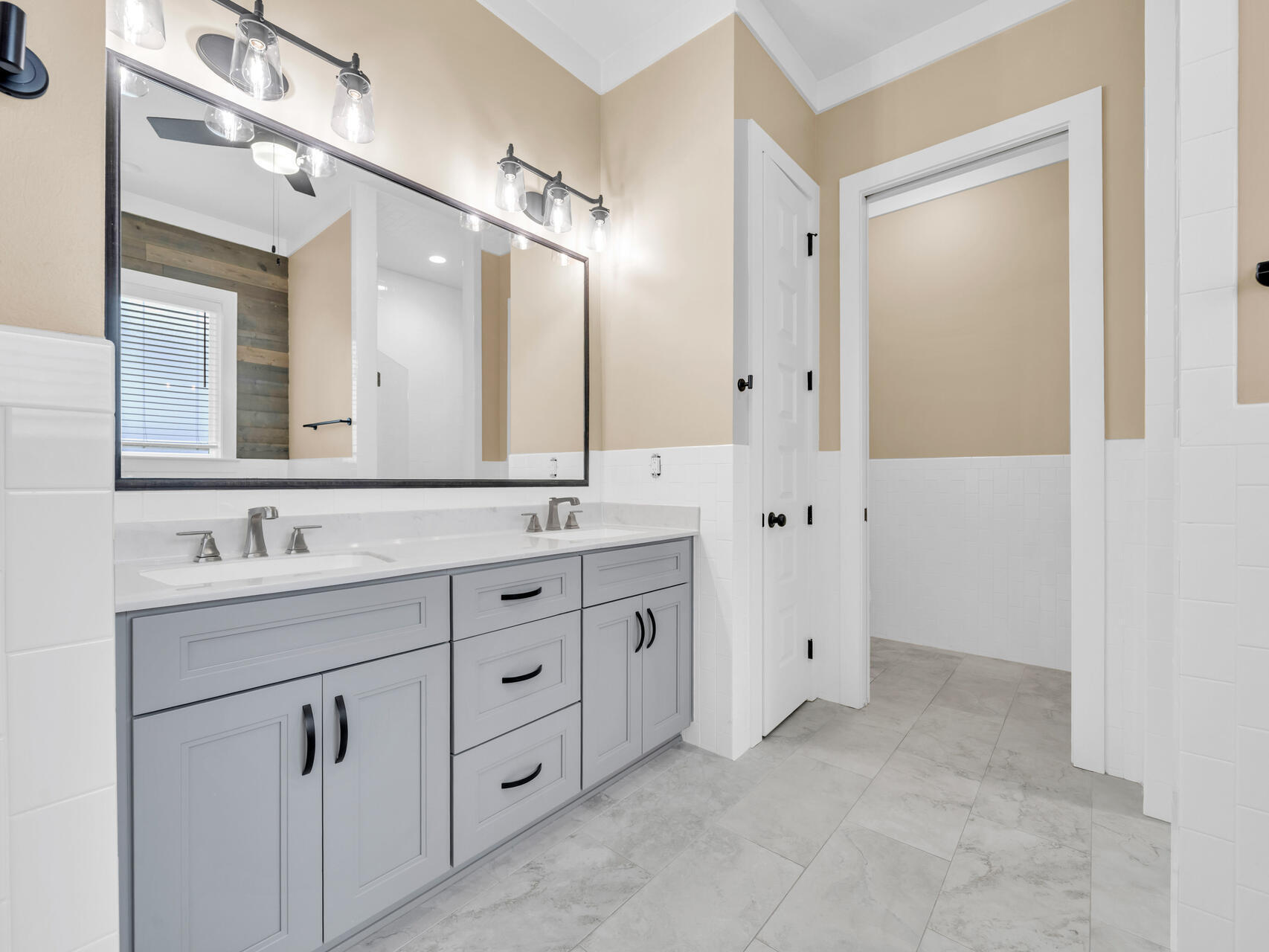 1160 Deer Moss Loop Niceville, FL 32578 - Photo 27 of 60 a bathroom with a double vanity sink and mirror with shower