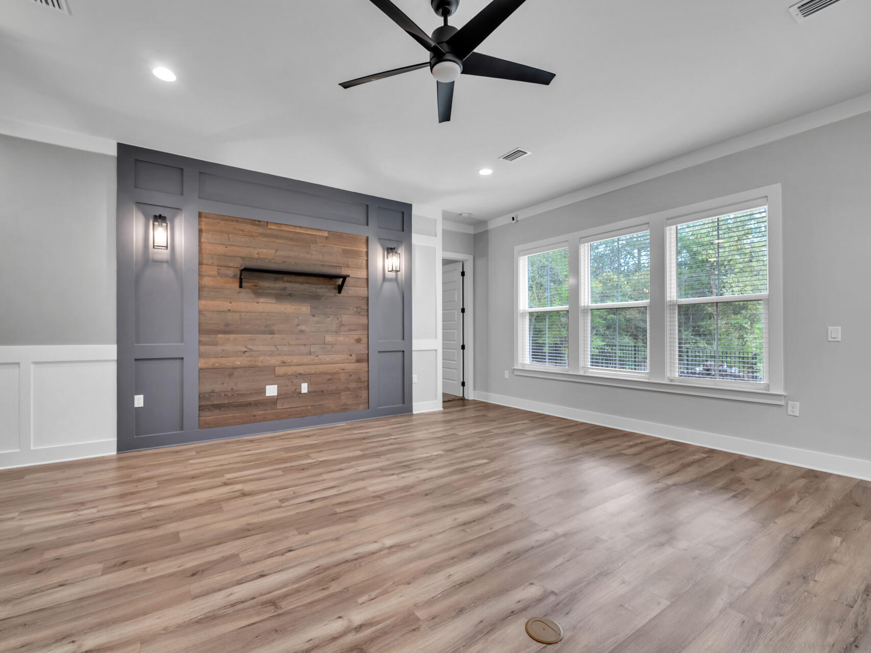1160 Deer Moss Loop Niceville, FL 32578 - Photo 6 of 60 a view of an empty room with a window and a ceiling fan