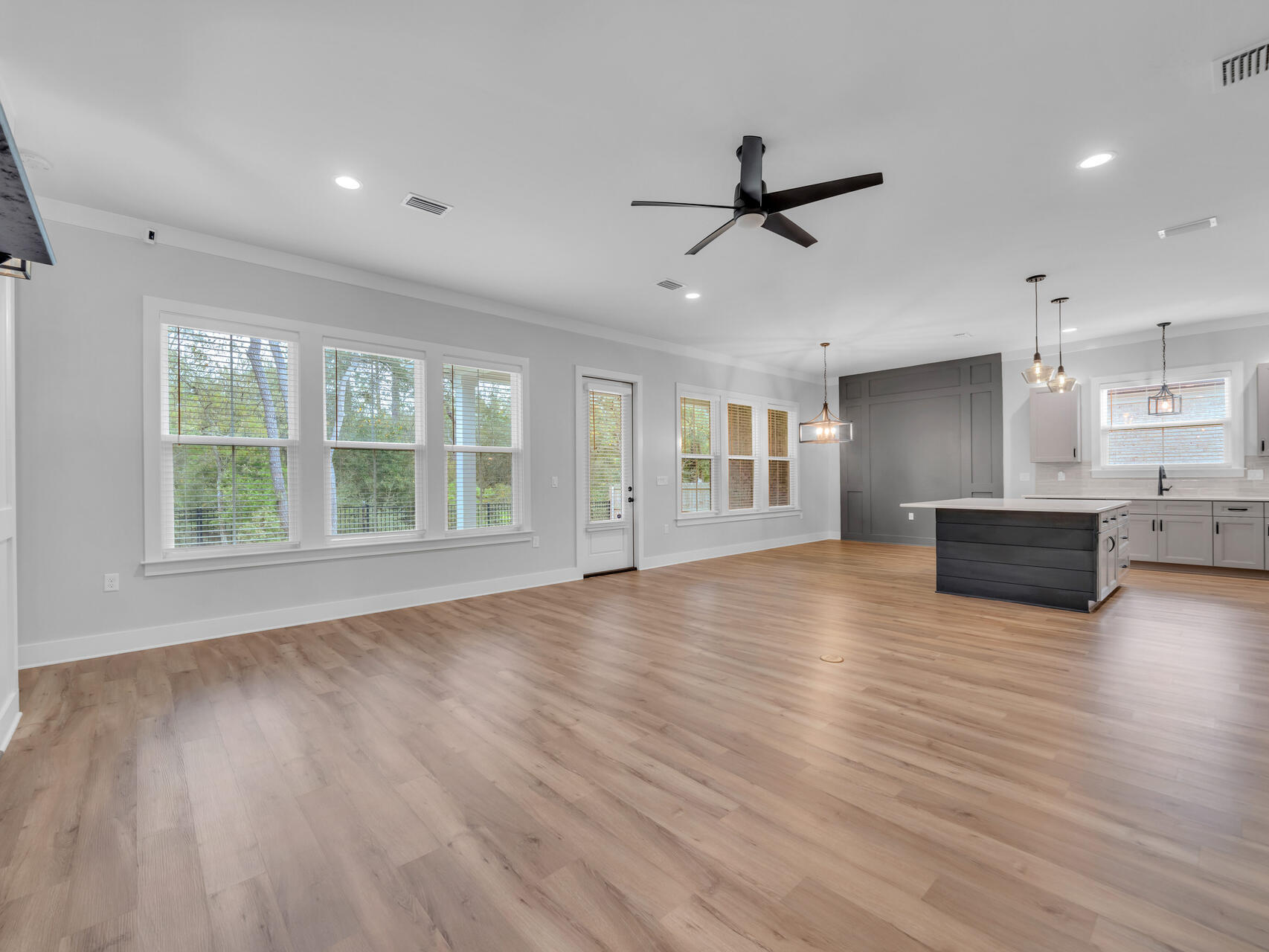 1160 Deer Moss Loop Niceville, FL 32578 - Photo 8 of 60 a view of a livingroom with wooden floor and staircase