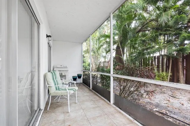 a view of two chairs in the balcony