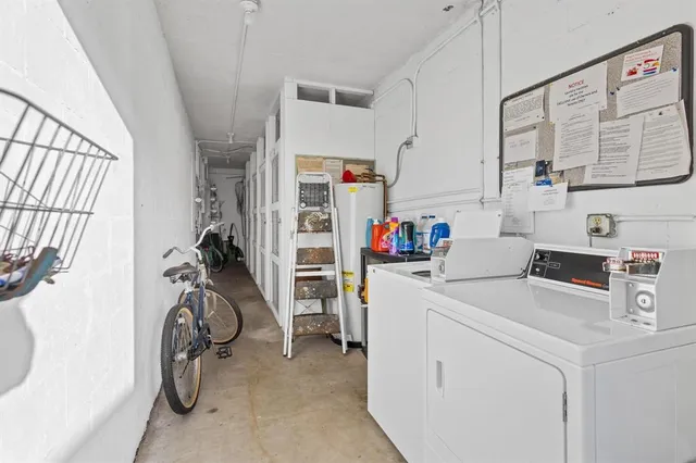 a view of storage and utility room with washer and dryer