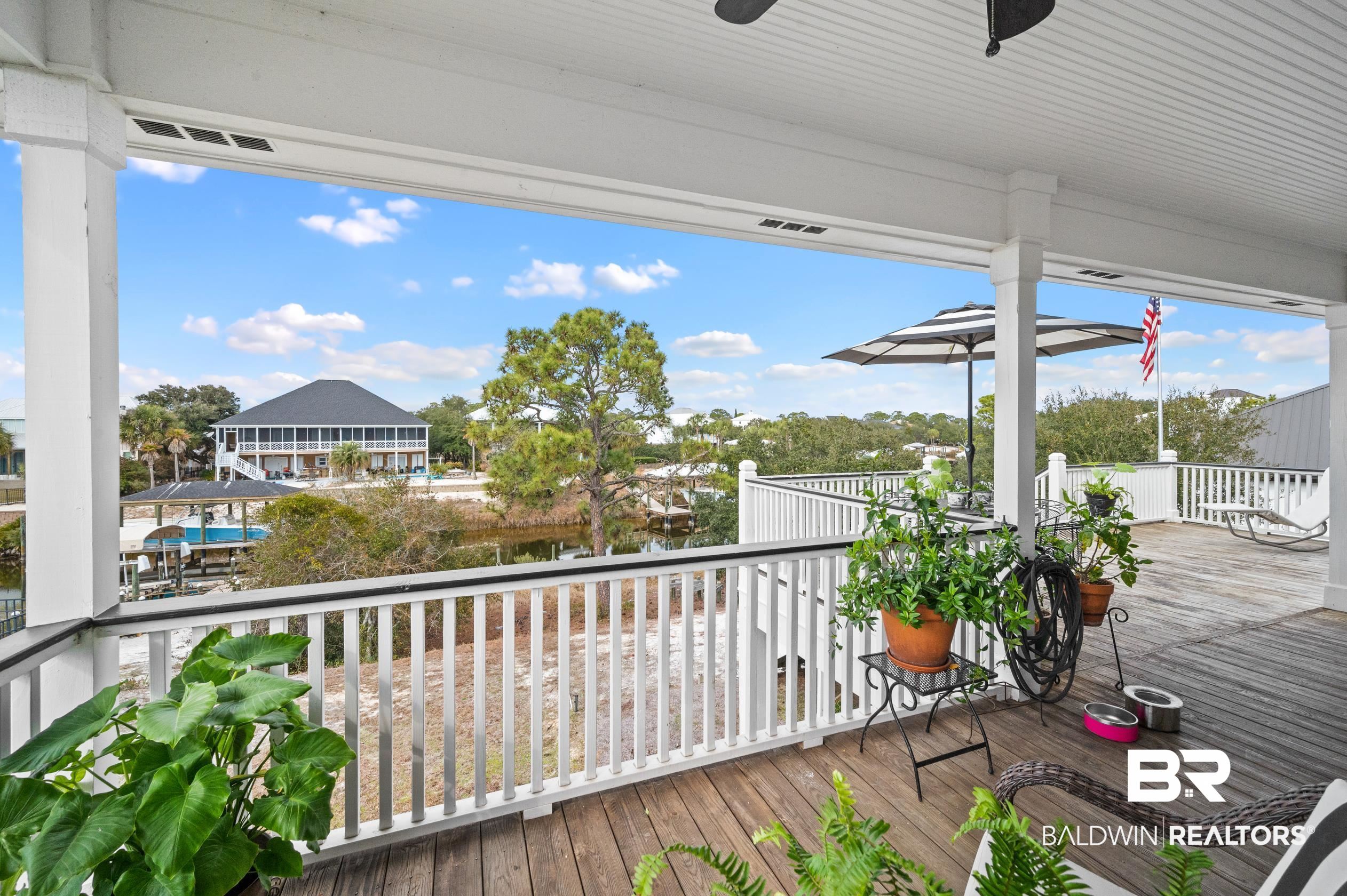 31835 River Road Orange Beach, AL 36561 - Photo 34 of 55 Wooden terrace featuring ceiling fan