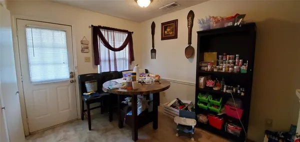 a view of a room with furniture and entryway