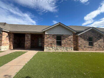 3205 112th Street Lubbock, TX 79423 - Photo 2 of 19 a front view of a house with garden