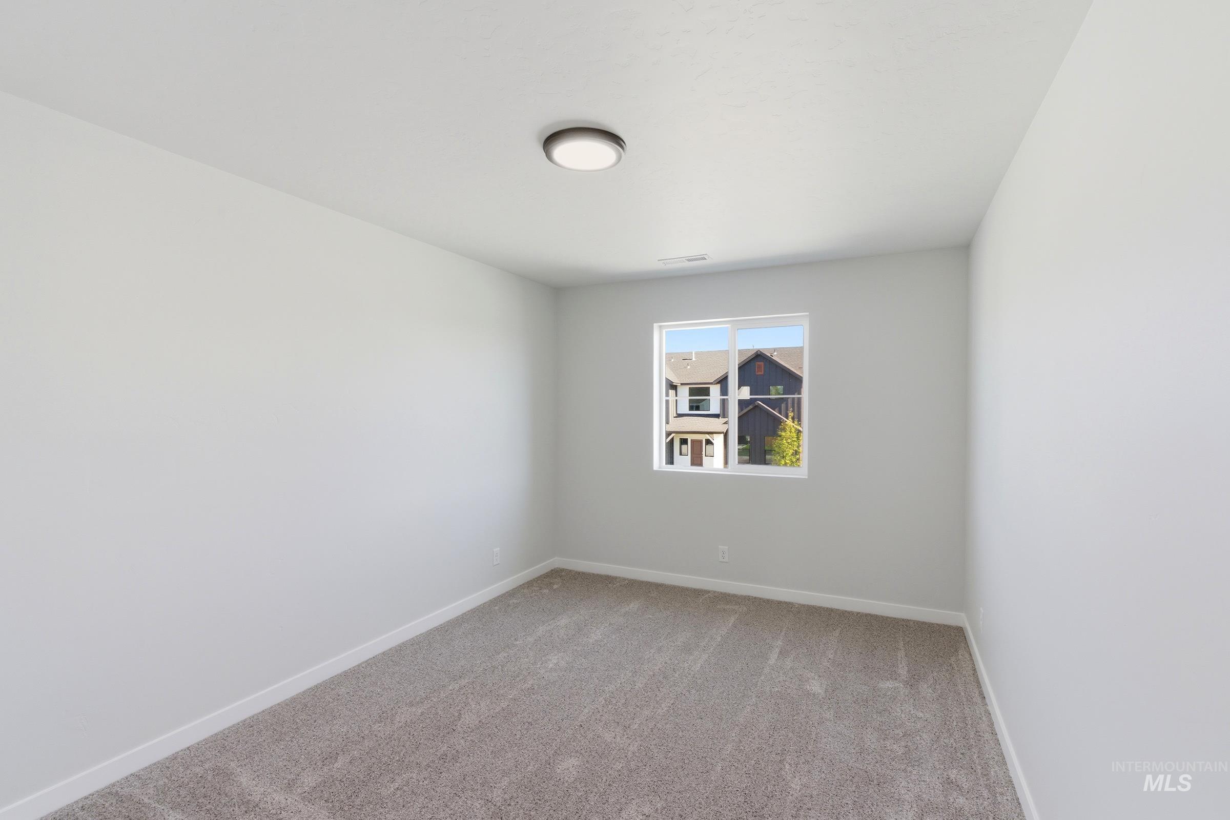 13677 Redway Court Caldwell, ID 83607 - Photo 24 of 35 Room featuring light gray carpet flooring, white baseboards, and neutral wall paint