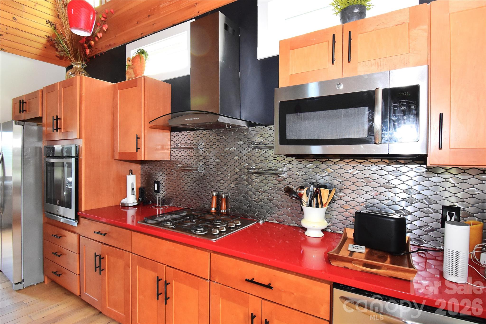 6 Belvedere Road Asheville, NC 28803 - Photo 4 of 33 a kitchen with stainless steel appliances wooden cabinets and a stove top oven