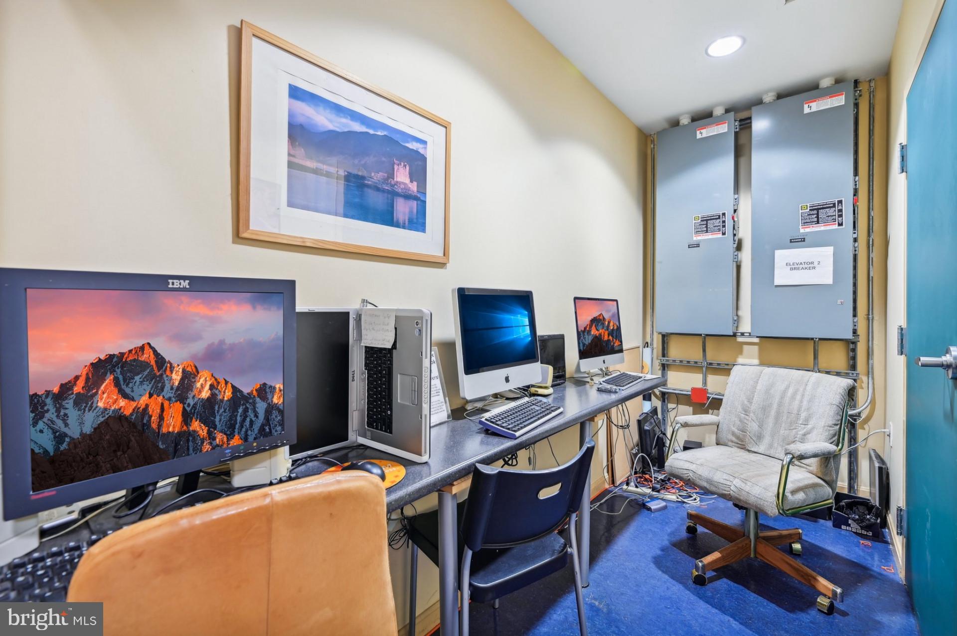 7981 Eastern Avenue Northwest, Unit 211 Silver Spring, MD 20910 - Photo 20 of 45 a living room with furniture and a flat screen tv