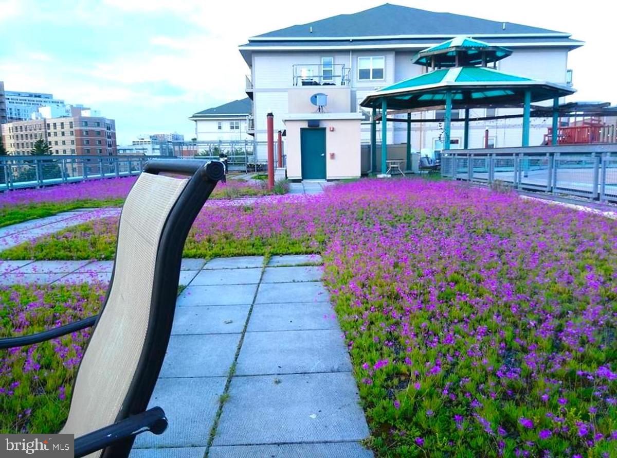 7981 Eastern Avenue Northwest, Unit 211 Silver Spring, MD 20910 - Photo 29 of 45 a front view of house with yard