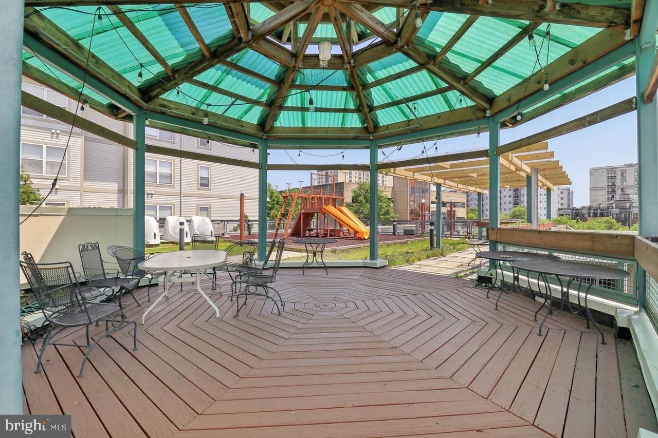 7981 Eastern Avenue Northwest, Unit 211 Silver Spring, MD 20910 - Photo 32 of 45 an outdoor space with seating