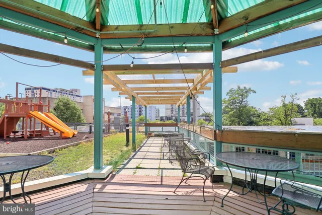 a view of a balcony with wooden floor