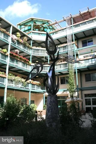 a view of a water fountain in front of building