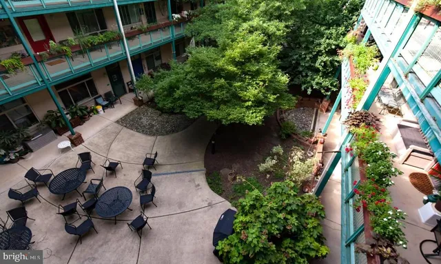 an aerial view of a backyard with plants and garden